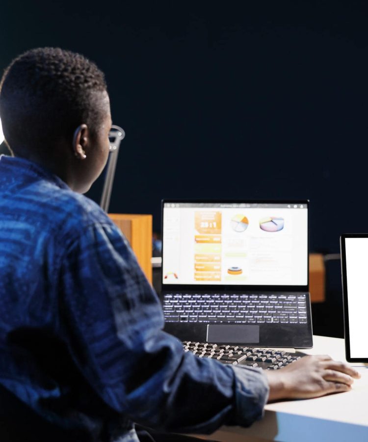 young-woman-using-laptop-home-min